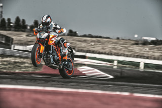 Motorcycle rider tiltshift hill trees - a person riding free wallpaper