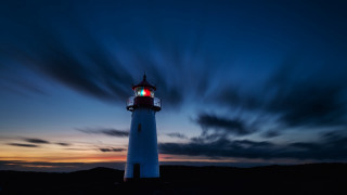 Lighthouse red light night clouds - a lighthouse free wallpaper