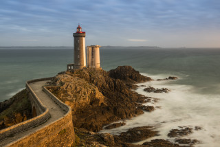 Lighthouse rockycliff ocean waves cloudy - thierry doizon free wallpaper