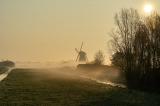 Windmill foggy field stream impressionist - a windmill in the distance free wallpaper