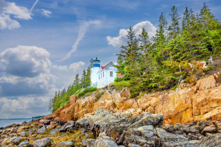 Lighthouse rocky shore trees blue - a rocky shore free wallpaper