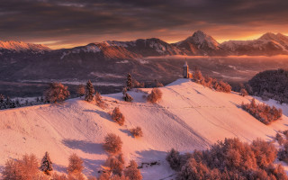 Snowy mountain church sunset clouds - radiant free wallpaper
