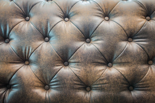 Leather upholstered wall buttons black - button free wallpaper