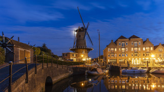 Windmill river boats night cityscape - a windmill free wallpaper