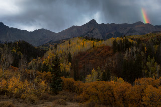 Rainbow mountains forests lake autumn - a dark sky free wallpaper for desktop