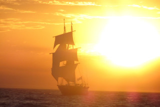 Sailboat ocean sunset clouds horizon 6 - the sun behind free wallpaper