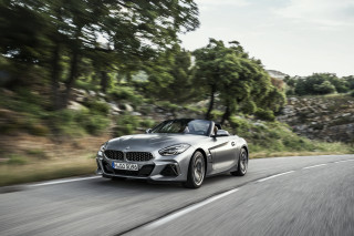 Silver bmw z4 driving road - tree and a forest free wallpaper