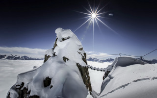 Snow mountain rope bridge sun - bright free wallpaper