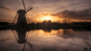 Windmill sunset water cityscape clouds - a windmill free wallpaper