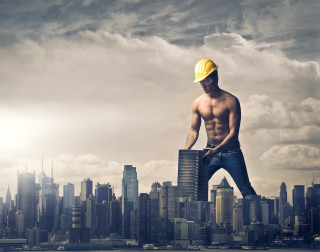 Man hardhat building ledge city - free city wallpaper