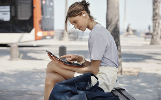 Woman bench tablet earbuds bus - free aesthetic wallpaper
