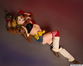 Woman costume laying ground toy - a toy free wallpaper