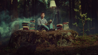 Man sitting pile books woods - free sci-fi wallpaper for desktop