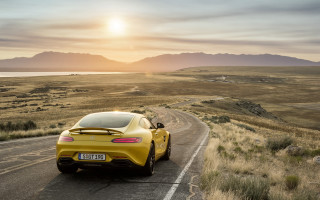Yellow sports car mountain range 2 - the sun setting free wallpaper