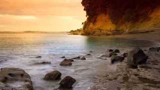 Rocky beach cliff water sunset - a rocky beach free wallpaper for desktop