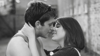 Man woman cuddling together street - dave kendall free wallpaper