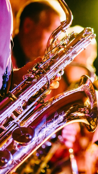 Close up person playing instrument - other person free wallpaper for mobile