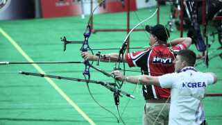 Man holding bow aiming another - dave arredondo free wallpaper
