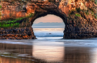 Large rock formation hole beach - a small boat free wallpaper