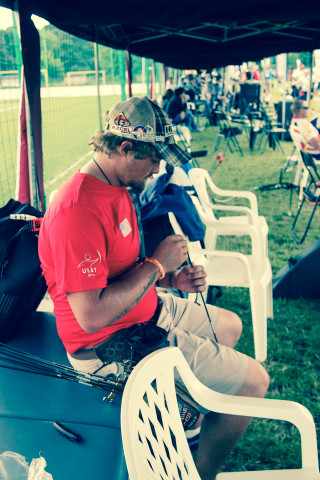 Man bench field cellphone bag - a tilt shift photo free wallpaper for mobile