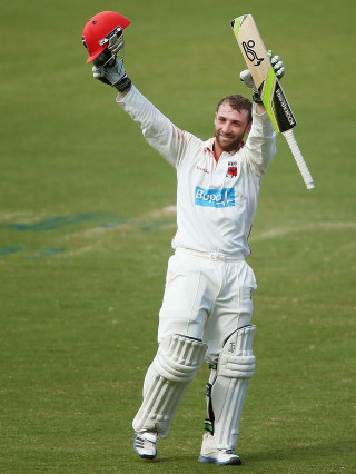 Man holding bat helmet grass 2 - bradley walker tomlin free wallpaper