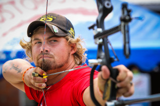 Man hat bow aiming arrow - mitchell mohrhauser free wallpaper