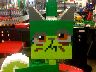 Lego head green monster red - front view free wallpaper