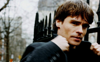 Man black fence serious look - heidelberg school free wallpaper