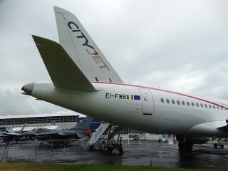 Large jetliner airport tarmac building - side profile free wallpaper