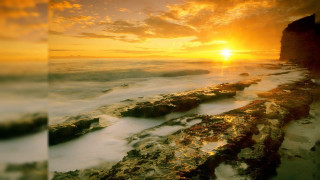 Sunset ocean rocky shore water - in the water free wallpaper