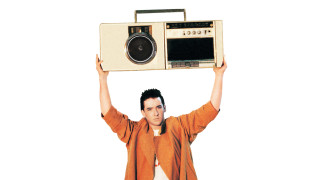 Man holding radio boombox on - dan smith free wallpaper
