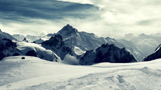 Skiing mountain snowy clouds horizon - a snowy mountain free wallpaper