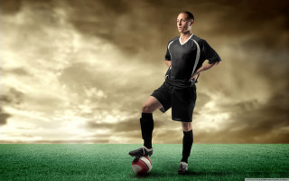 Man soccer uniform standing on - a soccer uniform free wallpaper