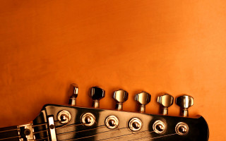 Guitar neck knobs yellow wall 2 - a yellow wall behind free wallpaper