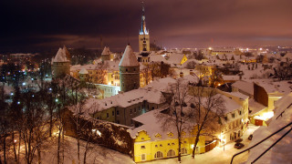 Snowy city nighttime buildings lights - medieval free wallpaper