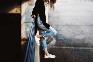 Woman leaning wall hands hips 2 - free vintage wallpaper for desktop