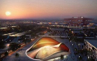 Large building curved roof sunset - a city in the foreground free wallpaper