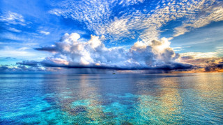 Beautiful blue ocean clouds boat - colorful cloud free wallpaper