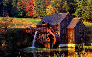 Water mill waterfall trees background - a waterfall in the background and trees free wallpaper