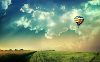 Hot air balloon sunbeam cloudy - a sunbeam in the foreground free wallpaper