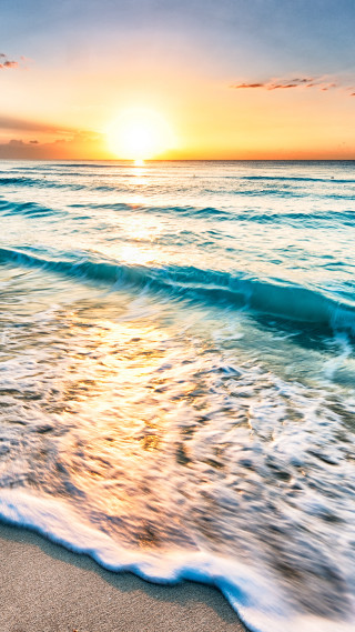 Beach wave sunset person walking - a sunset in the background free wallpaper for mobile