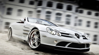 White sports car driving street 4 - a white sports car free wallpaper