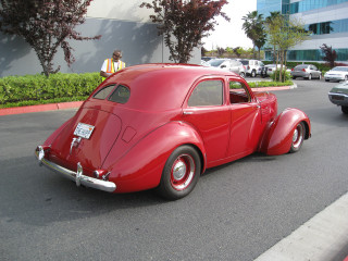 Red car parked road building 3 - the side of a road next free wallpaper