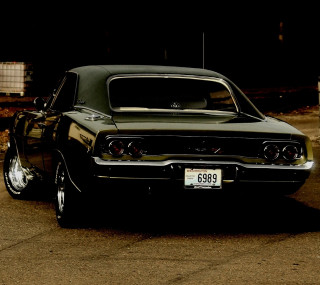 Green car parked dark road - free cars wallpaper for tablet