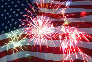 Large american flag fireworks background - a large american flag free wallpaper