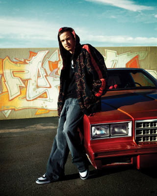 Man leaning red car graffiti - free cars wallpaper