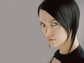 Woman black hair black shirt 4 - perfect eye free wallpaper