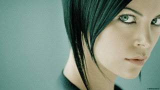 Green haired android serious portrait - her face and shoulder free wallpaper