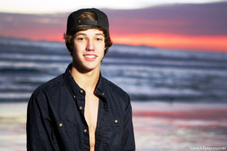 Young man hat ocean sunset - cam sykes free wallpaper