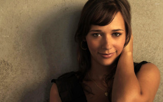 Woman posing hand on head - seductive smile free wallpaper